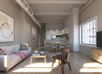 A living room and kitchen in a small apartment